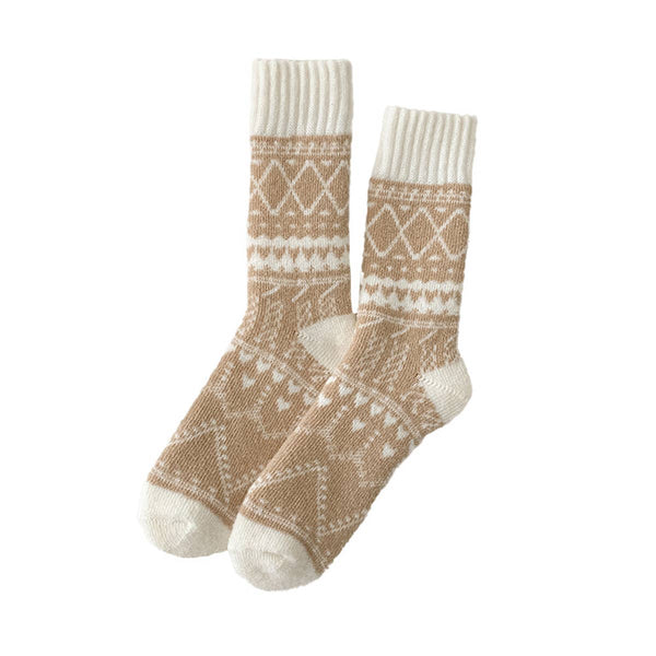 Pair of brown and white patterned socks on a white background