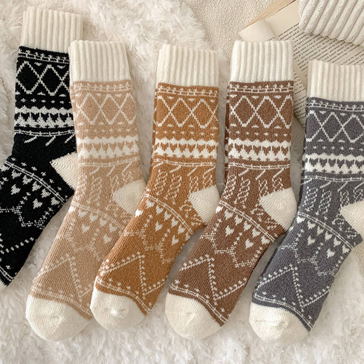 Set of patterned socks in various colors on a soft surface