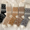 Set of patterned socks in various colors on a soft surface