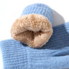 A close-up of a light blue ribbed knit beanie with a soft tan faux-fur lining rolled up at the brim, shown on a white background.