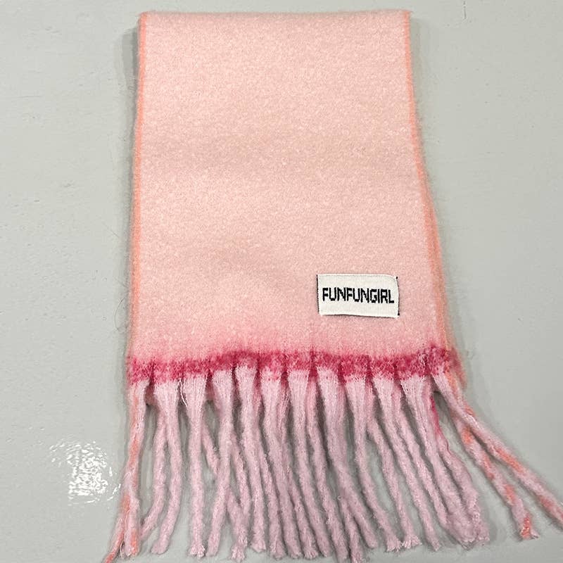 A light pink fuzzy scarf with a darker pink gradient band near the fringe and a white brand label reading 'FUNFUNGIRL' on a light gray background.