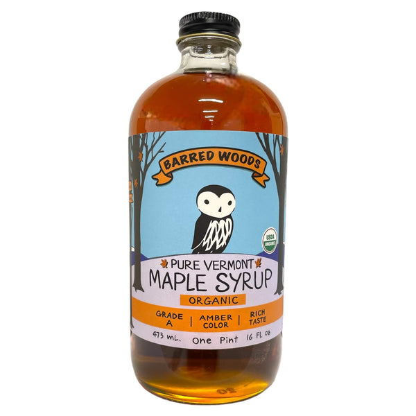 Bottle of Barred Woods Pure Vermont Maple Syrup on a white background