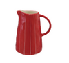 A glossy red ceramic pitcher with vertical white pinstripes and a cream-colored interior, shown on a plain white background.