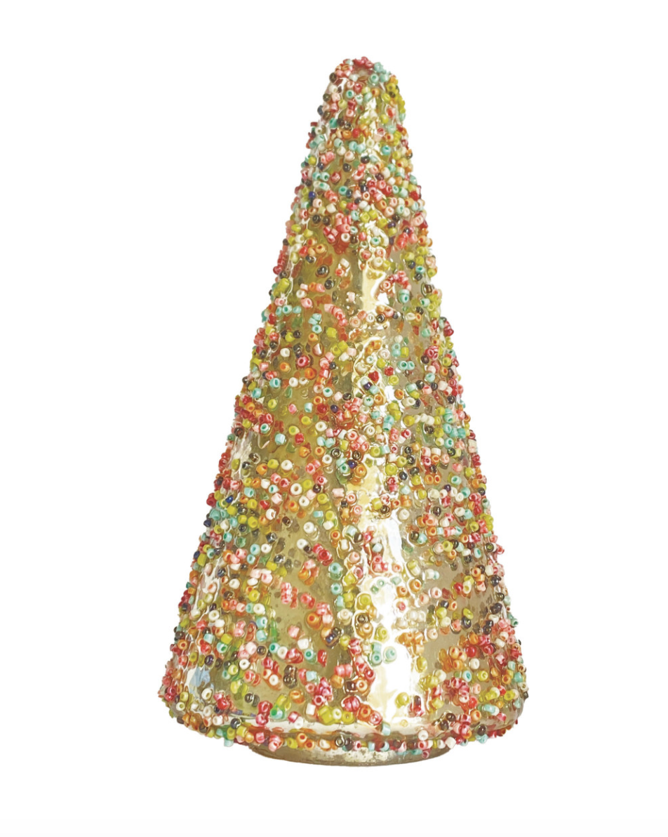 A gold glitter cone hat covered in colorful sequins, photographed against a solid white background.