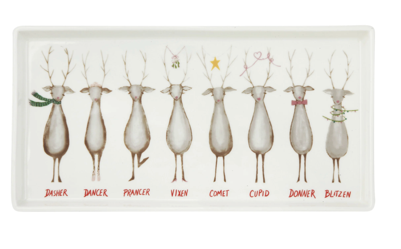 A rectangular white ceramic tray featuring a row of nine illustrated deer labeled Dasher, Dancer, Prancer, Vixen, Comet, Cupid, Donner, Blitzen, with small red names underneath each deer.