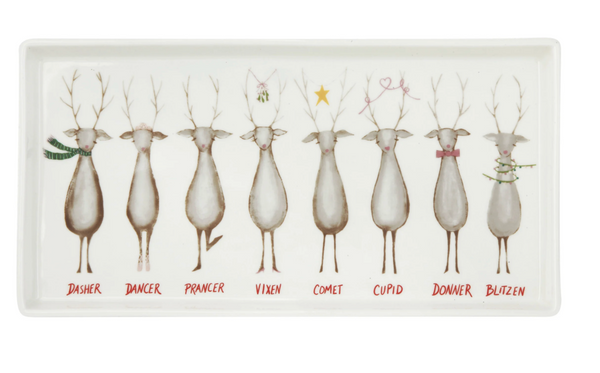 A rectangular white ceramic tray featuring a row of nine illustrated deer labeled Dasher, Dancer, Prancer, Vixen, Comet, Cupid, Donner, Blitzen, with small red names underneath each deer.