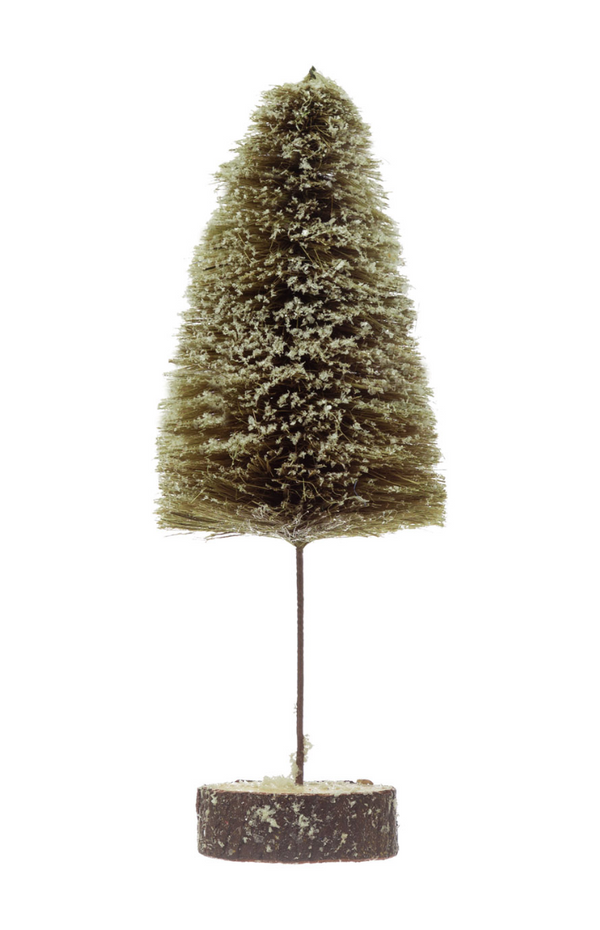 A small artificial brush-style tree with a conical shape, covered in light beige faux snow, mounted on a thin dark stem and round textured base, isolated on a white background.