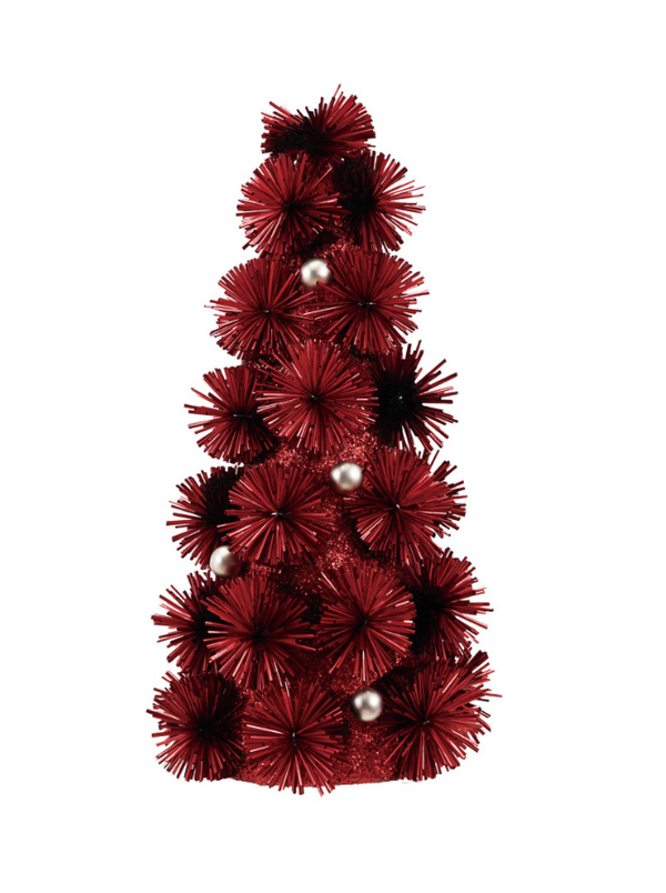 A small artificial Christmas tree in a conical shape, decorated with deep red spiky foliage and a few shiny silver ornaments, isolated on a white background.