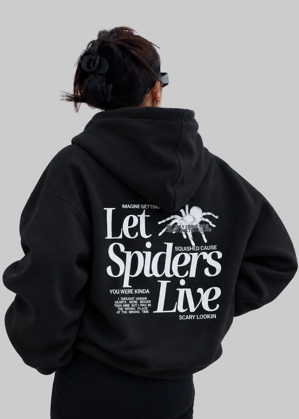 black sweatshirt on model showing back design in white that says let spiders live with graphic of a spider White background