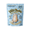 A stand-up pouch of 'White Chocolate Snowball' frozen cocktails by No Blenders Ever, featuring a light blue winter-themed background with snowflakes and an illustration of a snowball cocktail.