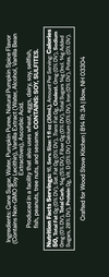 A dark green label with white text showing product ingredients, nutrition facts, and branding for Crafted for Wood Stove Kitchen.