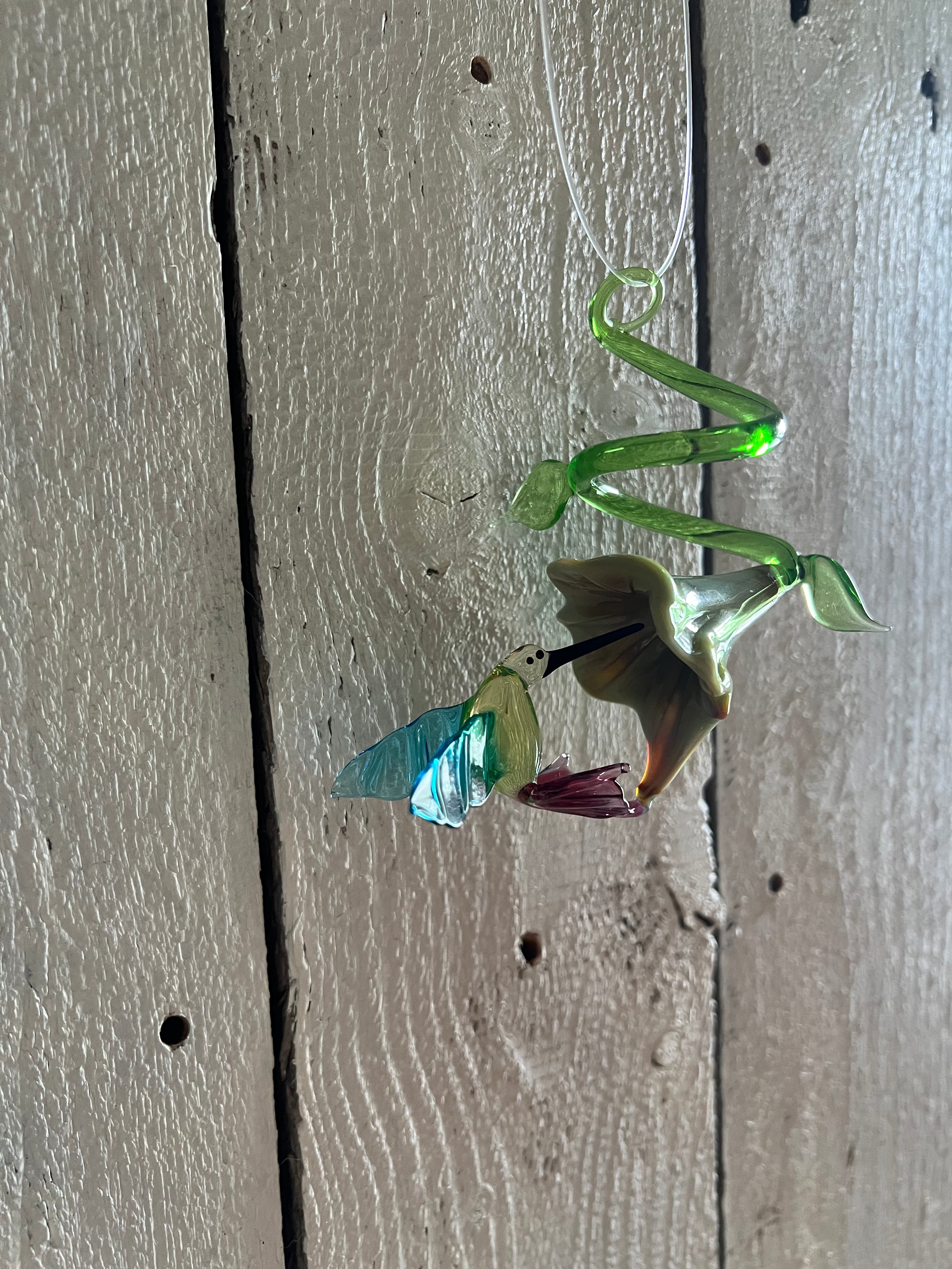 LOCAL GLASS HUMMINGBIRD WITH FLOWER HANGING