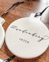 PORCELAIN TOWN NAME WITH ZIP CODE ORNAMENT