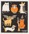 A decorative dish towel with various cartoon animals in costume party outfits, primarily in black with a list of eco-friendly product labels at the bottom.